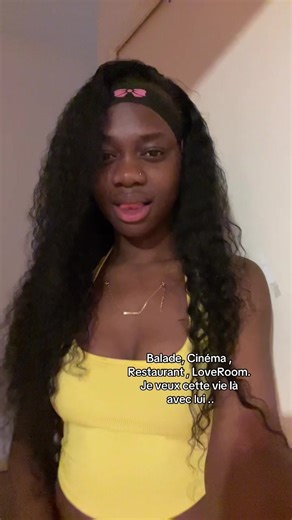 Young Woman in Yellow Top Poses Gracefully