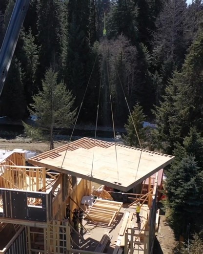 Panelized roof components and wall. For this reno project, the builder RDC Fine Homes kept the existing foundation and the bottom floor. That was challenging because they needed to remove the top two floors of this early 1970s house in Whistler. The structure was prepared so it can be taken this off in sections in a way that is safe and sustainable. Project by RDC Fine Homes Inc in BC. | Mike Holmes