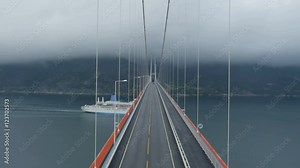 Aerial Shot of Suspension Bridge Hardanger in Norway. Weather is Foggy and Cloudy.