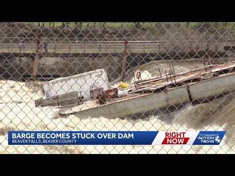 Barge gets stuck over dam in Pennsylvania