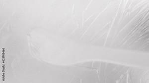 Transparent liquid texture on a light gray background top view. Pattern of cosmetic smears beauty sample.