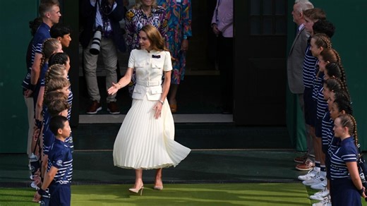 Kate, Princess of Wales, presents winner's trophy to Iga Swiatek after women's final at Wimbledon