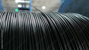 Winding cable on a rotating coil. Production of electric cable.