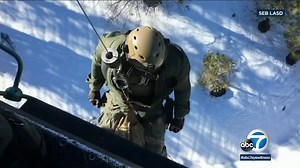 2 people, 2 dogs rescued after being trapped in snow for 14 days