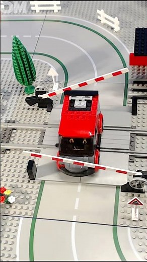 Lego City Trains, trucks and more at a level crossing.