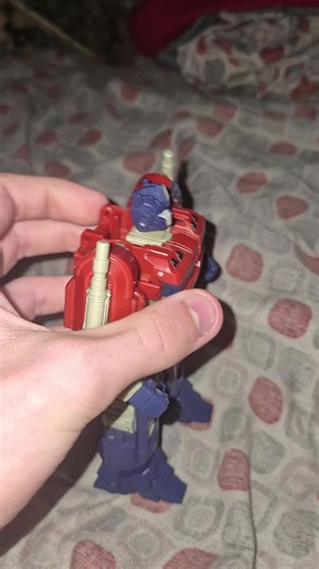 Optimus Prime walking into bumblebee