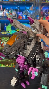 Hasbro’s Transformers Generations Selects Age of the Primes G1 Trypticon stands at 18 inches (45 cm) tall, comes with Decepticon Full-Tilt figure. This Titan Class features triple conversion between dinosaur, spaceship, and city modes. Definitely a worthy addition to our growing collection of Titan Class Transformers. We need more space! #Transformers #Hasbro #Trypticon | Geek Culture