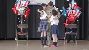 SURPRISE! 12-year-old Abigail and 8-year-old Johan Torres, students at St. Bernadette School in Springfield, Va. are shocked when the curtains on the school's stage were pulled back during an assembly earlier this afternoon. Lt. Col. Jose Torres, who just finished a year-long assignment in South Korea, and his wife Wendy wanted to give their kids one last, special memory while Jose is still a Soldier. He will retire after 30 years of service this summer. To see their priceless reaction click on 