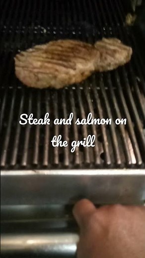Chefjames cooking rib eye steaks and salmon on the grill at Talia's Steak House
