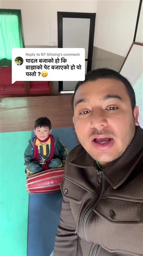 School Boy Playing Madal: A Cultural Showcase