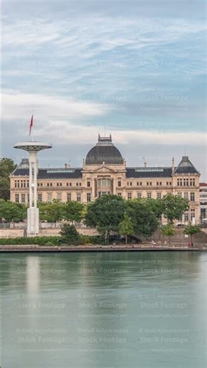 Panoramic hyperlapse view of the Rhone River and its embankment, featuring the University Jean
