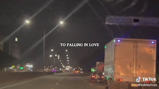 Urban Nighttime Highway Scene with Illuminated Truck