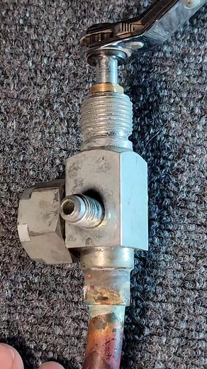 Listen the backing gland nut before operating a multi position service valve. From Emerson " This valve uses a packing material with a gland nut that can be identified by the wrench flats. Before activating the valve stem, loosen the brass gland nut (usually with a 7/16 wrench). This will lessen the amount of packing material being removed by moving the valve stem and help prevent the valve stem from leaking. After valve stem is seated (front or back), torque brass gland nut to ~ 6-8ft/lbs." #lo