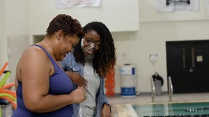 Meet Trish Miller, a 2017 graduate of Emory's Rollins School of Public Health and winner of the Emory Alumni Association's 2022 Community Impact Award. Miller was 19 years old when she dove headfirst into 12-foot-deep water. It was spring break, and after a 15-minute swim lesson from friends, she mustered the courage to take the leap. Adrenaline soaring, her body crashed into the water. It was a frantic few moments before Miller realized that she had no idea how to float or tread water. Luckily,