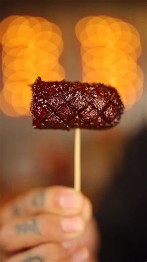 Tony Ramirez | TFTI BBQ on Instagram: "Game Day Hot Dog Burnt Ends 🌭🔥 This is tailgate food done right. Took some humble dogs and turned them into straight money. Seasoned heavy with my new Cajun Honey Rub Spicy Garlicky, then smoked on the @chargrillergrills Kettle using @jealousdevilcharcoal Max briquettes, Boom Fire starters, and Hickory wood blocks for that real smoke flavor. Once they were smoked out, I sauced them up with @blazingstarbbq sauce and a drizzle of @melindasfoods Hot Honey to