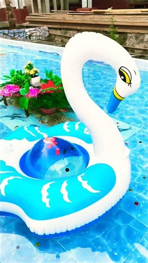 Popping giant water balloon in a swan float! 🦢💥 #asmr #pool #poppballons #experiment #ballongame