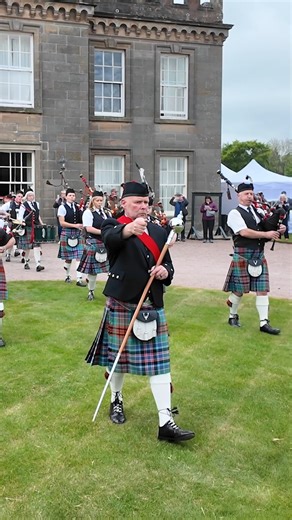 Strathisla Pipe Band march off by Gordon Castle during the 2025 Gordon Castle Estate Highland Games and Country Fair. This was held on Sunday 18th May 2025 within the Estate at Fochabers in Moray, Scotland, and the band, who were finishing their display outside the Castle, marched off playing Lord Lovat's Lament and We’re No Awa’ tae Bide Awa. #gordoncastle #marchingband #strathislapipeband | Scotland's Pipe Bands
