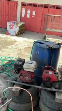 Motorcycle washing, plus guy discovered why back tire had such a bad wobble. Java, Indonesia