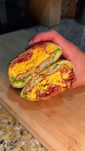 KT on Instagram: "Follow so you don’t miss the pop-up details 🤫 Crispy cheesey breakfast burrito -bacon fat hashbrowns -bacon -avocado -cheesey soft scrambled eggs -flour tortilla @vistahermosaproducts #recipe #eats #food #cooking #breakfast #burrito #breakfastburritos #breaky #eggs #bacon #cheese"