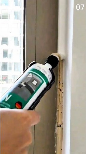 Applying window frame sealant using handheld caulking gun tool