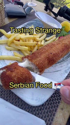 Tasting the iconic Serbian food, Karadjordjeva 😎🇷🇸 would you eat this? #Serbia #Belgrade #Food #Travel | Iikee
