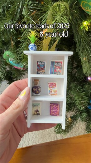 KIDS FAVORITE BOOKS OF 2025 We made our annual bookshelf ornaments with our favorite reads, and here are a few from my kids! 12-year-old: Spy Family Yozakura Family Assassination Classroom 10-year-old: Lightfall series Snoop Tea Dragon series Chi's Sweet Home Spy Family The Traitor Moth (note we only started this in 2025 but she's loving it so insisted it was included) 8-year-old: DogMan Captain Underpants Lightfall Pizza & Taco Did your kids have favorite reads of 2025? #kidsbooks #childrensboo