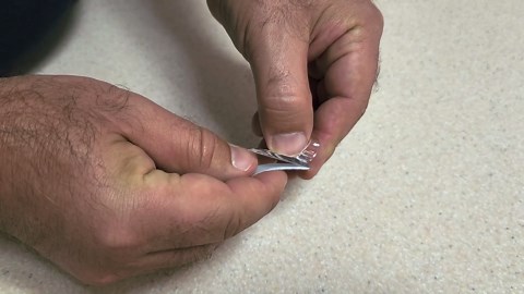 Stick command hooks under your kitchen cabinets (this is brilliant!)