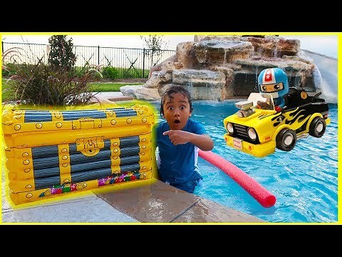 Ryan found treasure with surprise toys in our swimming pool!!! Car Racing playtime fun!!!!