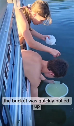 catching fish with a bucket