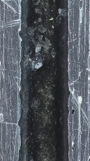 Fiber laser engraving groove under a microscope: #macrophotography #microscope #wiggle stereoscopy