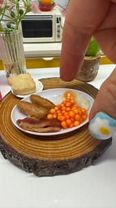 Tiny Breakfast in the Mini Bakes kitchen, not my full moshings but bacon, sausage, egg, beans and slightly toasted bread! What’s on your breakfast plate. I’m cooking more #breakfast #tinyfood #mini #foodie | My Mini Bakes