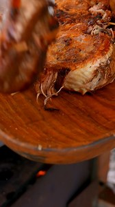 Tender meat slowly cooked over open fire in the snowy wilderness, paired with fresh herbs and pasta. #OutdoorCooking #OpenFire #WildernessCuisine #Cooking | Wilderness Grill