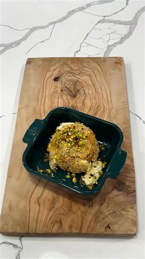 Crispy Baked Boursin cheese makes the ultimate holiday appetizer! It’s so simple to Make and It takes just a couple minutes to put together. 1 Boursin cheese 1 egg 2/3 cup Italian seasoned Panko bread crumbs 1 tbs Honey 1/4 tsp red pepper flakes 2 tbs Chopped pistachio Whisk the egg in a bowl and then take the cheese coat it in the egg and then in the breadcrumbs then coat it back in the egg and then back into the breadcrumbs. Place the cheese onto a baking dish sprayed with nonstick spray and b