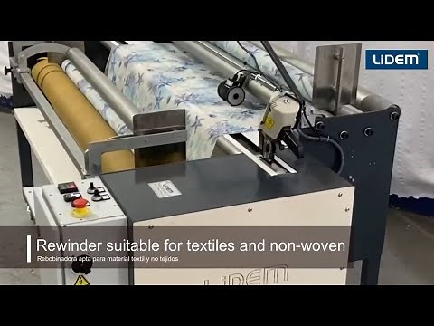Fabric rewinding machine with tension control and meter programming