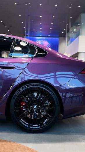 BMW Carlsbad on Instagram: "2026 M5 in Purple Silk Metallic paired with Silver/Black Extended Merino Leather Interior Available 💜😮‍💨 . The 2026 BMW M5 is packed with a 718-hp plug-in hybrid powertrain combining a 4.4L twin-turbo V8 and electric motor, delivering 735 lb-ft of torque and an estimated 0-60 mph time of 3.0 seconds. It offers up to 30 miles of electric range, M-tuned xDrive AWD and adaptive suspension. The design features sharper lines, a wider stance, and a high-tech interior wit