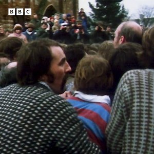 The Kirkwall Ba' Game on Orkney will be kicking off shortly. It’s a game in which two teams must fight through the streets of Kirkwall, carrying, kicking, or smuggling a leather ball towards their respective goals. In this clip from 1981, we hear a little bit about the game and an interesting tale about its origins. | BBC Archive