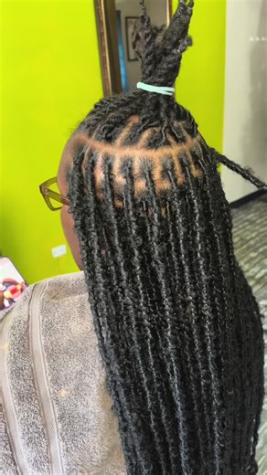 Have you ever wondered if you could get faux locs over your real locs? Yes you can. Most people choose this when they want a slightly different look but still want to keep their locs. A consultation is required to book this appointment. Visit our website today. #locs #fauxlcs