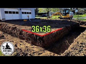 Mini Excavator Digging Garage