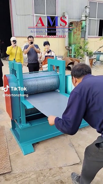 Embossing panel rolling machine