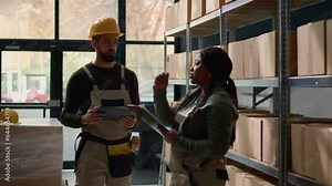 Professionals in warehouse storage area inputing updated products info on online shopping website, walking through retail workplace aisles monitoring labels on wares, crosschecking with inventory list