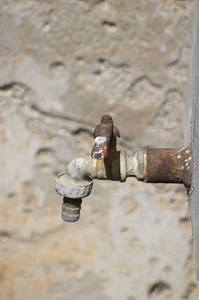 How to Seal Pipe Holes in a Brick Wall