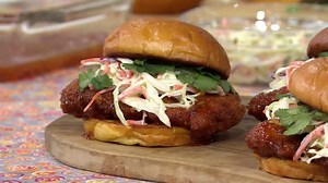 Chrissy Teigen demonstrates her recipe for orange chicken sandwiches