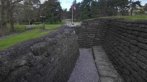 clip-4042452861-visitor-walks-through-preserved-world-war-trenches