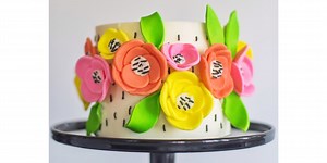 Decorate lemony cake with bright flowers for a fresh spring dessert