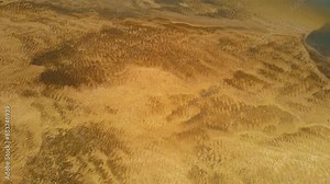 River water near shore ripples brown golden hue, bottom under water like sandy desert. Nature created texture for background, wallpaper, text placement