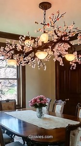 A cherry blossoms chandelier is a pretty light that looks like pink flowers hanging from the ceiling. Each blossom sparkles softly and makes the room feel warm and cozy. When the lights are on, it feels like you are sitting under a real cherry blossom tree in springtime.This chandelier brings happiness to any room. Kids love looking up at the pink flowers as they gently glow. It makes bedtime feel peaceful and special, just like a magical garden filled with cherry blossoms! | Glow Lockets by Mon
