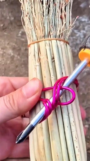 Securing a broom handle with wire and a tool so it stays tight, neat, and wont come loose during use