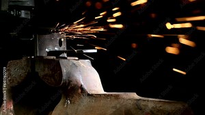 Metalwork welding using grinder Cutting Polishing Machine Disk. Bright sparks fly during metal cutting.