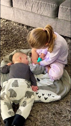 Big sister playing doctor with baby brother 😊