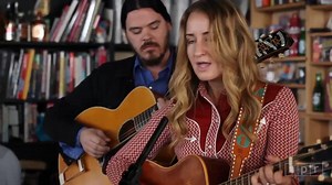 When I greeted Margo Price in the NPR garage before her Tiny Desk performance, tears were streaming down her face. It was Wednesday morning, Nov. 9, the day after the 2016 election. For her — as for many Americans — it was a stunning and bewildering moment in time, a day when life and the everyday took on new meaning. And so when she and her band began to play "All American Made," a song she's sung many times before, those words about America's changes and failures in the 21st century seemed eve